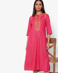 AURELIA Printed A-line Dress with Back Tie-Up, stylish flared fit for modern ethnic wear.