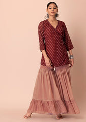 INDYA Maroon Tiered Sharara And Angrakha Kurta, structured ethnic wear with tiered detailing.